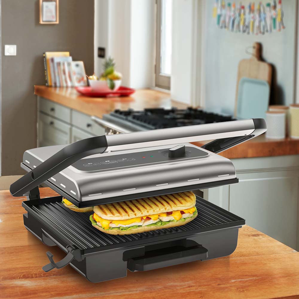 sandwich in a grill press on the kitchen counter - MyHouse