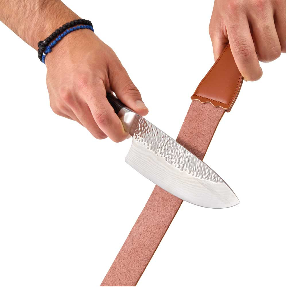 Man sharpening knife with leather strop - MyHouse