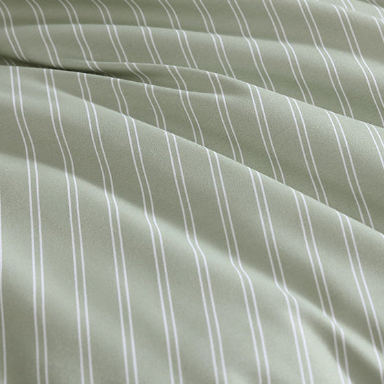 Fabric with subtle pinstripes on a light green background