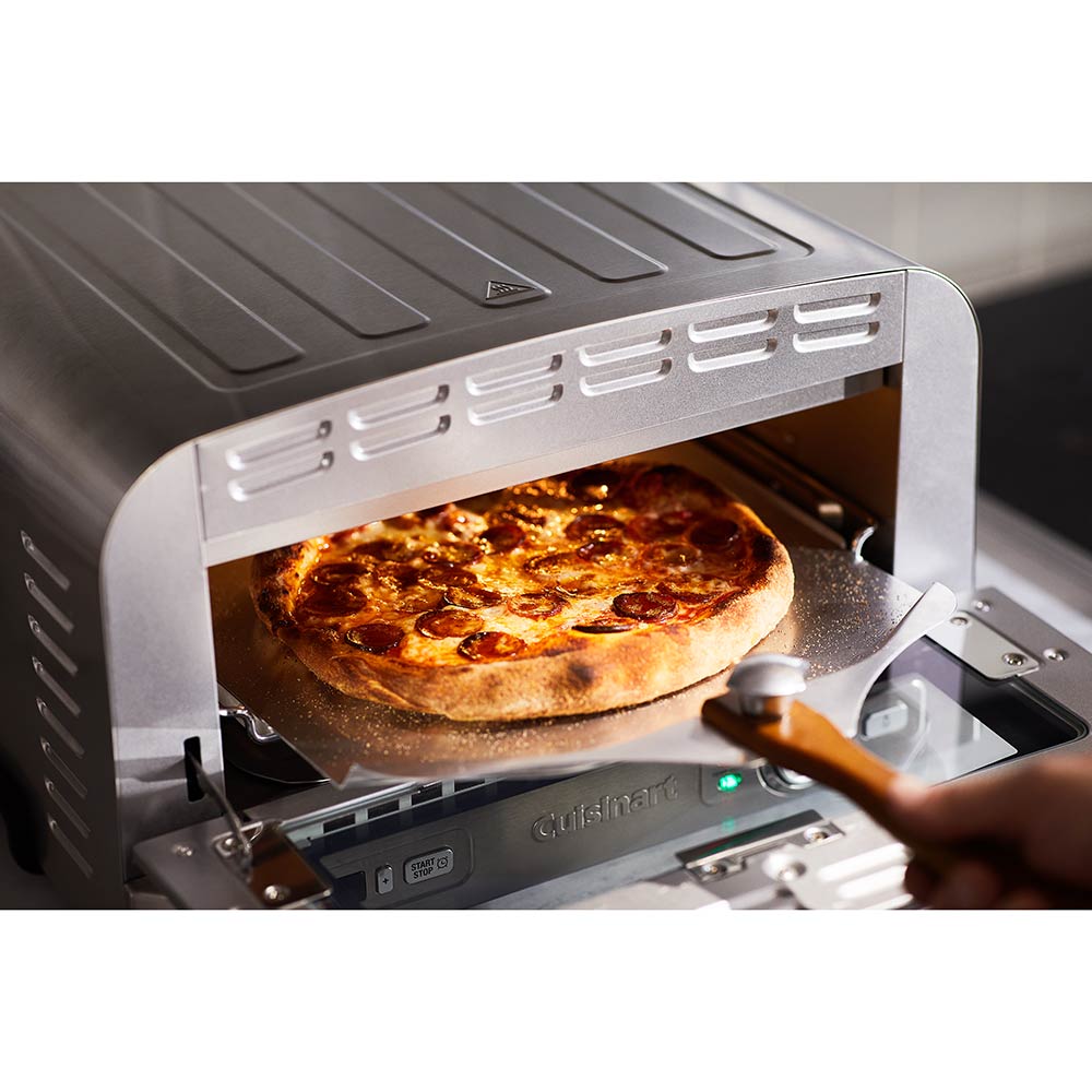 Pizza being removed from Indoor Pizza Oven - MyHouse