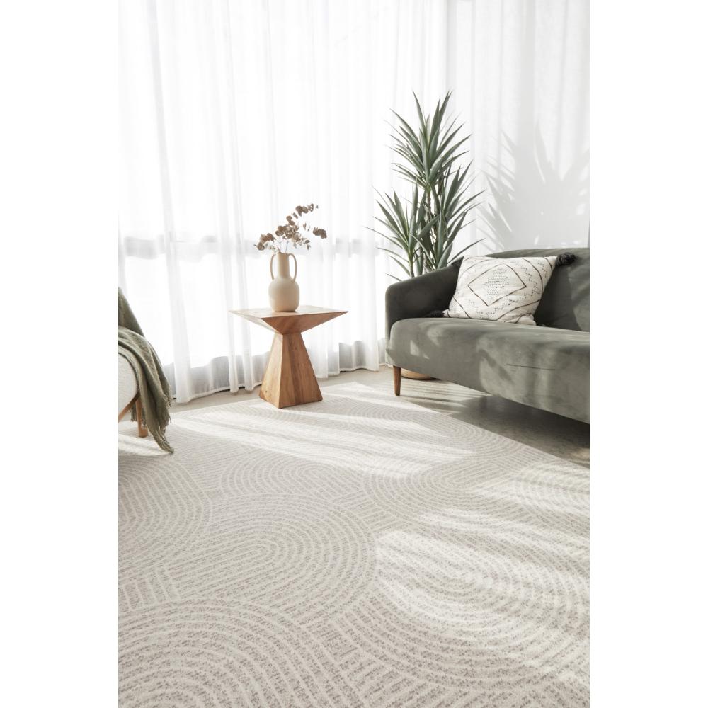 natural colour wool rug with arch design in a sun drenched room - MyHouse