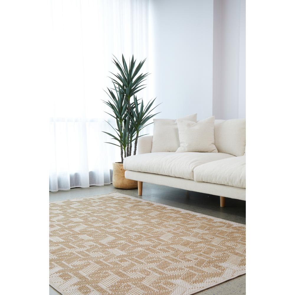 Indoor/outdoor natural weave look rug in the loungeroom - MyHouse
