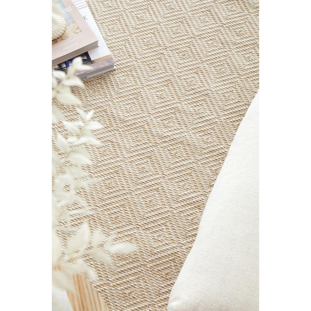 Beige brown diamond design indoor outdoor rug with stack of books - MyHouse