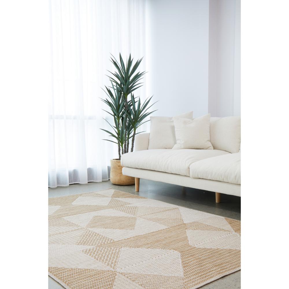 Indoor/outdoor natural brown beige geometric rug in a loungeroom - MyHouse