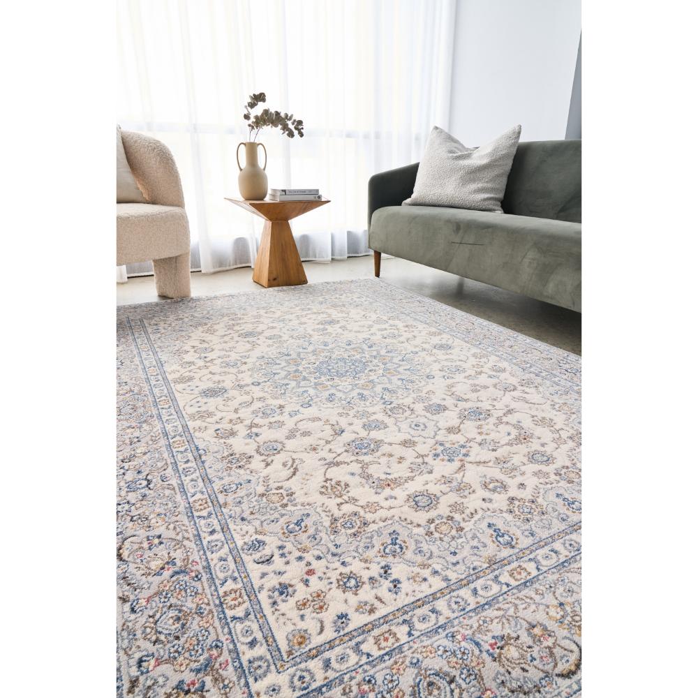 Vintage look blue and cream wool rug in a loungeroom - MyHouse