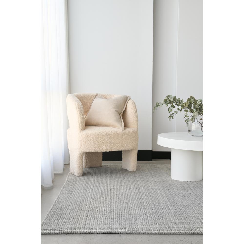 grey hamptons style jute wool rug with boucle chair - MyHouse