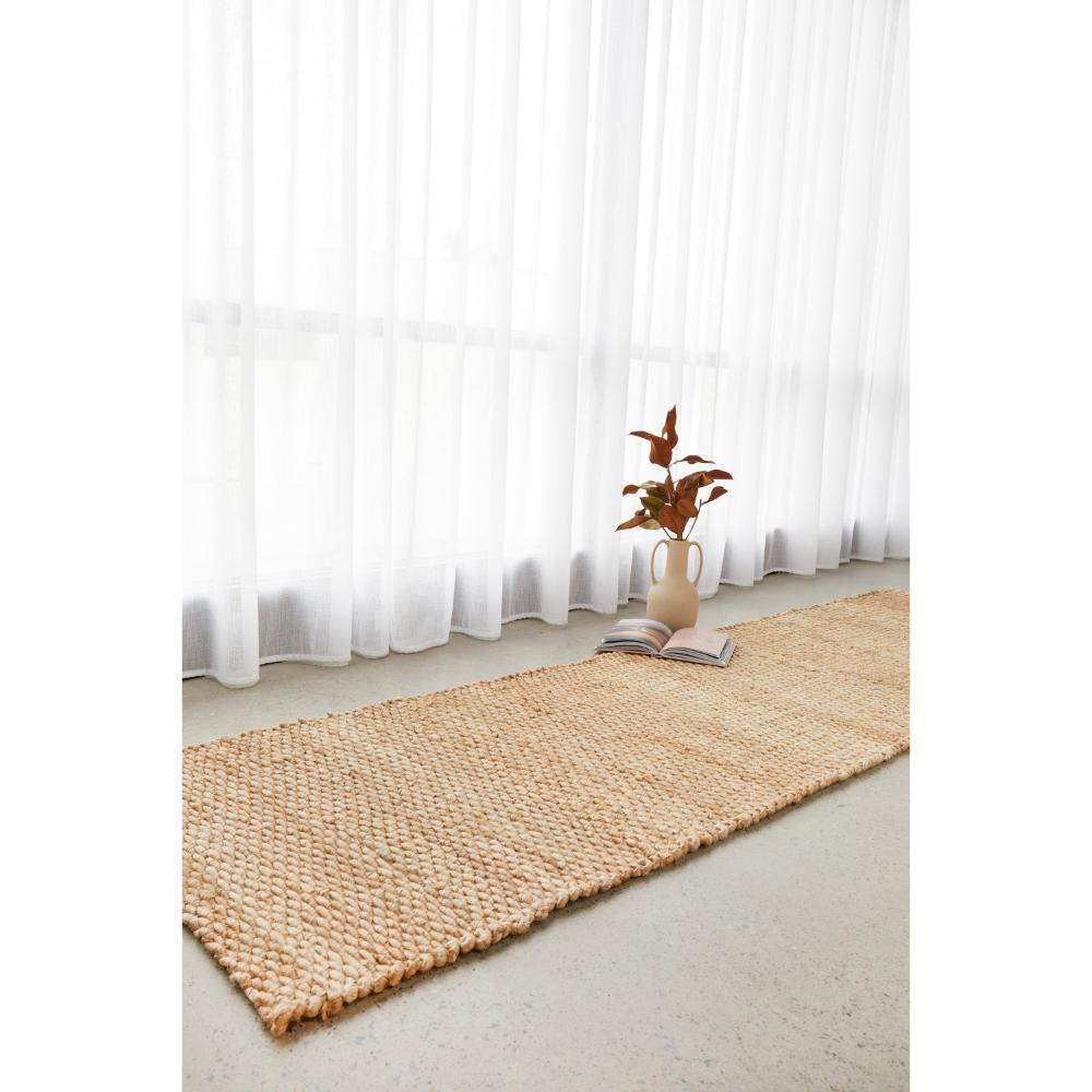 Natural Brown Jute Hampton Rug by a window - MyHouse