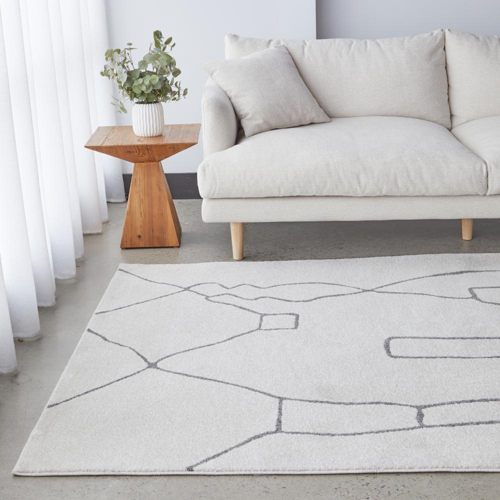 grey modern abstract rug with cream lounge and side table - House