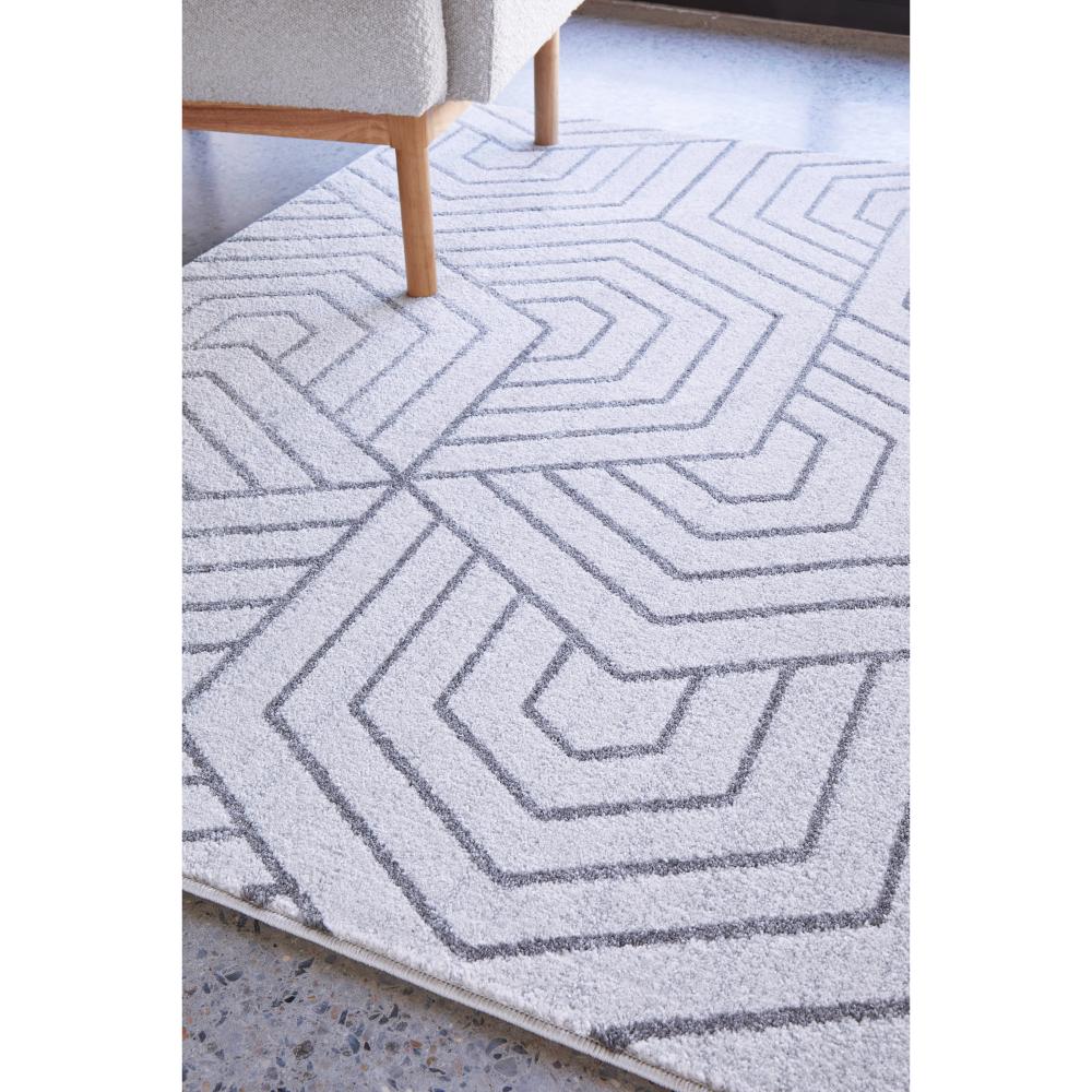 grey modern rug with art deco design with armchair - MyHouse