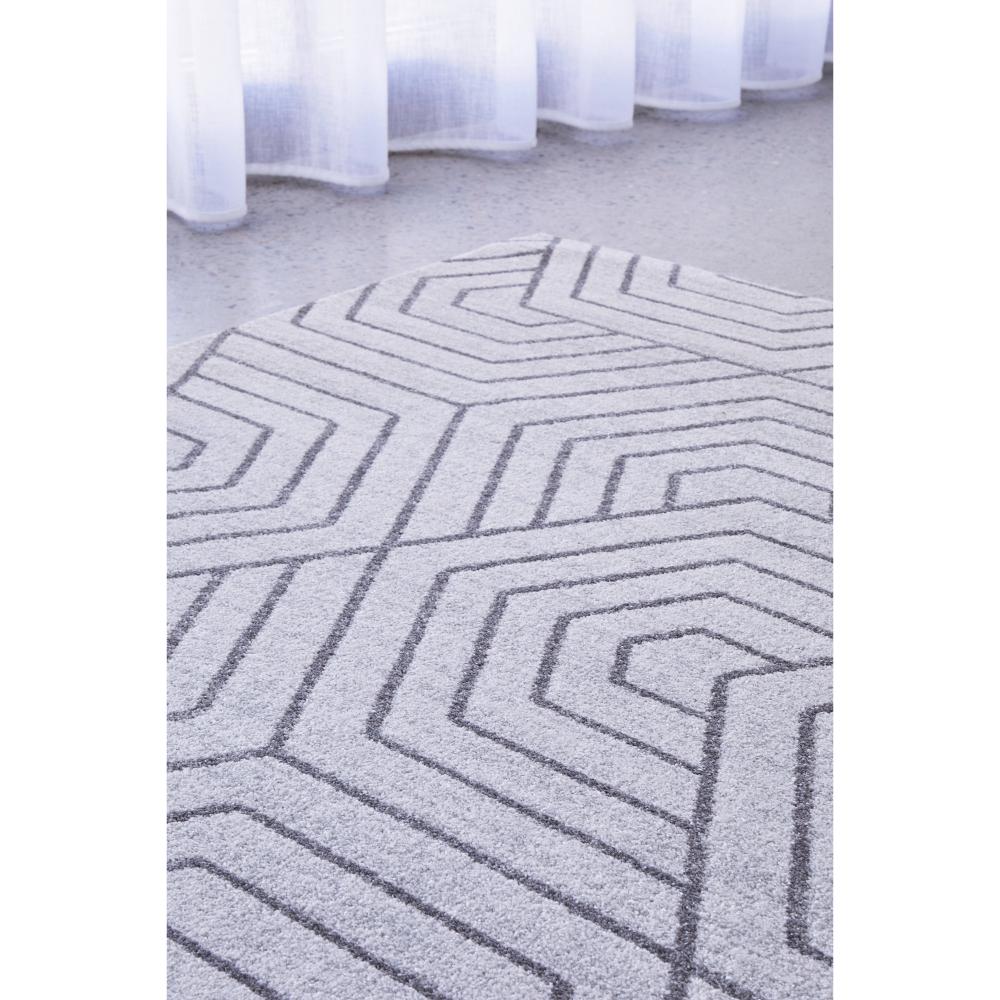 grey modern rug with art deco design by the window - MyHouse