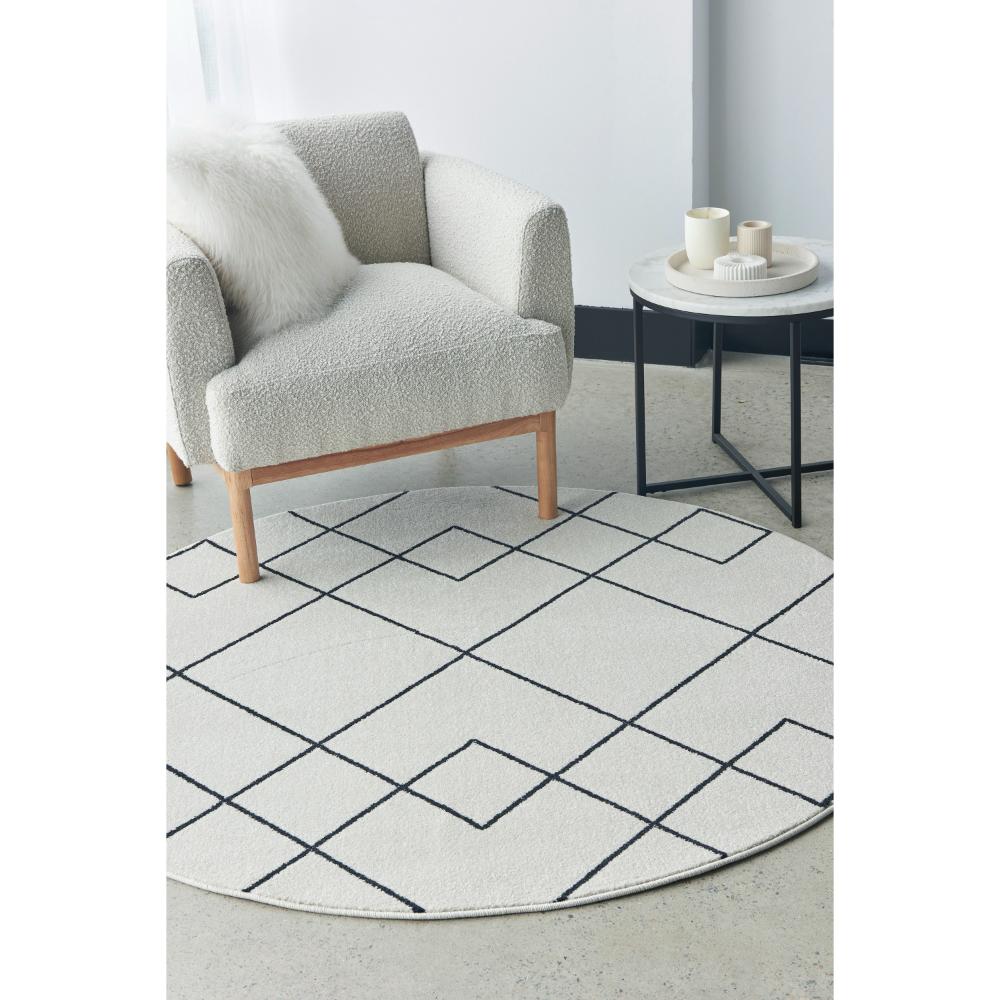 grey abstract round rug with armchair and side table - MyHouse