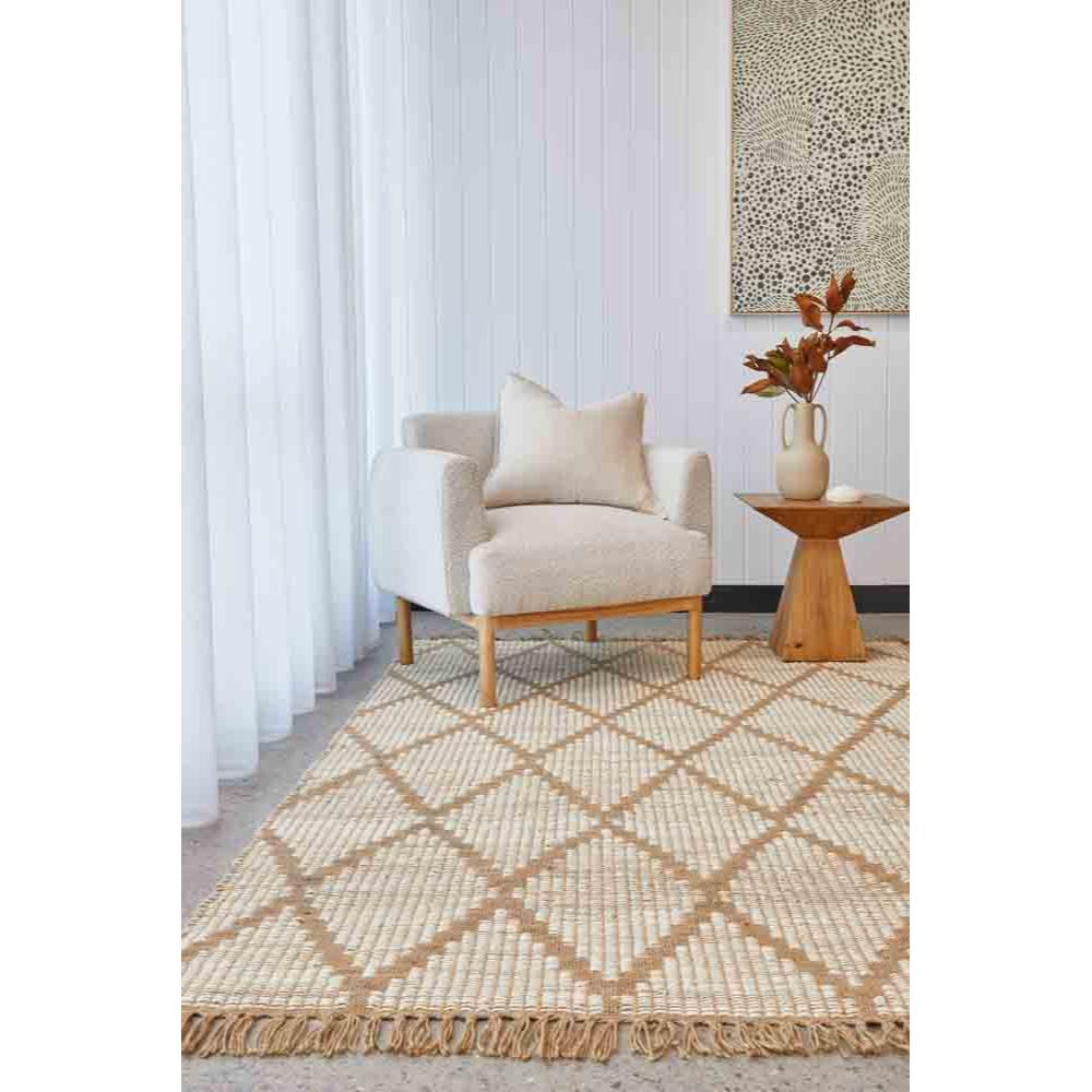 beige diamond design rug in a loungeroom with armchair - MyHouse