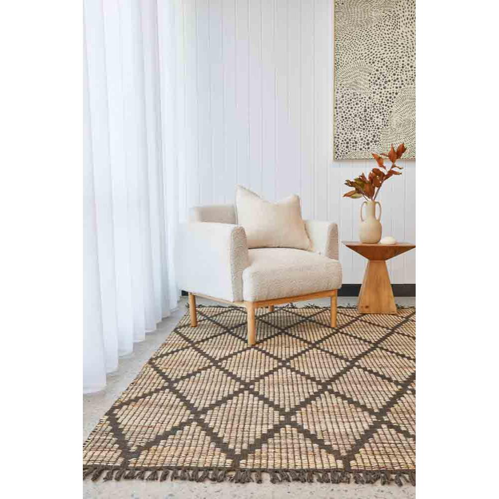 beige diamond design rug in a loungeroom with armchair - MyHouse