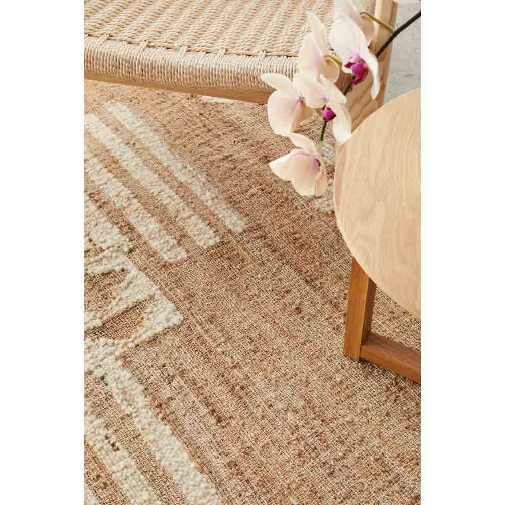 warm beige jute bohemian rug with chair and orchid - MyHouse
