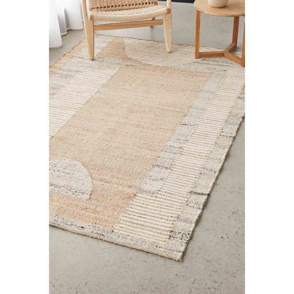 warm beige abstract jute wool rug with armchair - MyHouse