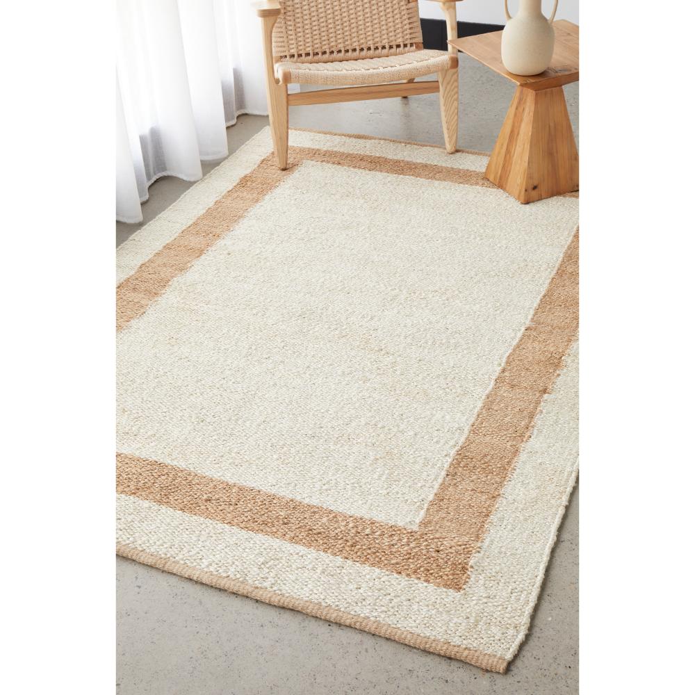 cream jute rug with beige border with armchair - MyHouse