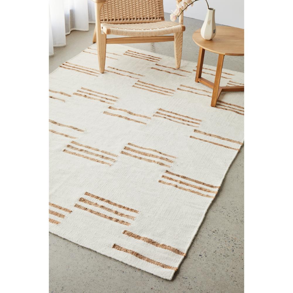 beige wool jute modern rug with armchair and table - MyHouse