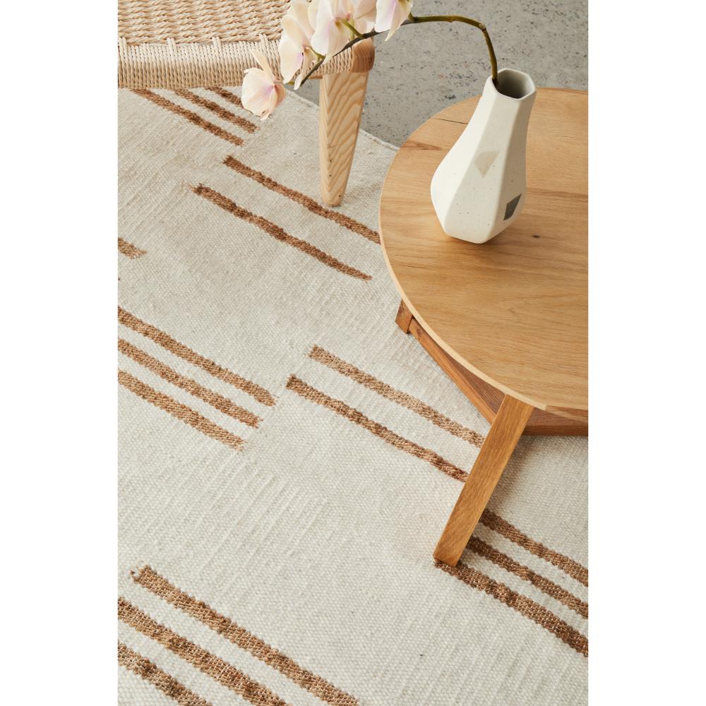 beige wool jute modern rug with armchair and table - MyHouse