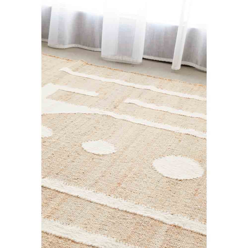 Natural beige wool jute bohemian rug by the window - MyHouse