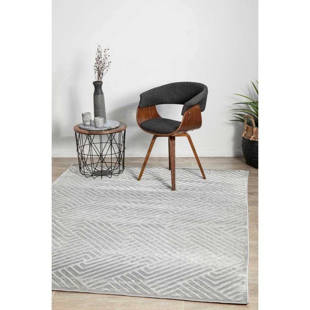 silver grey chevron rug with armchair and side table - MyHouse