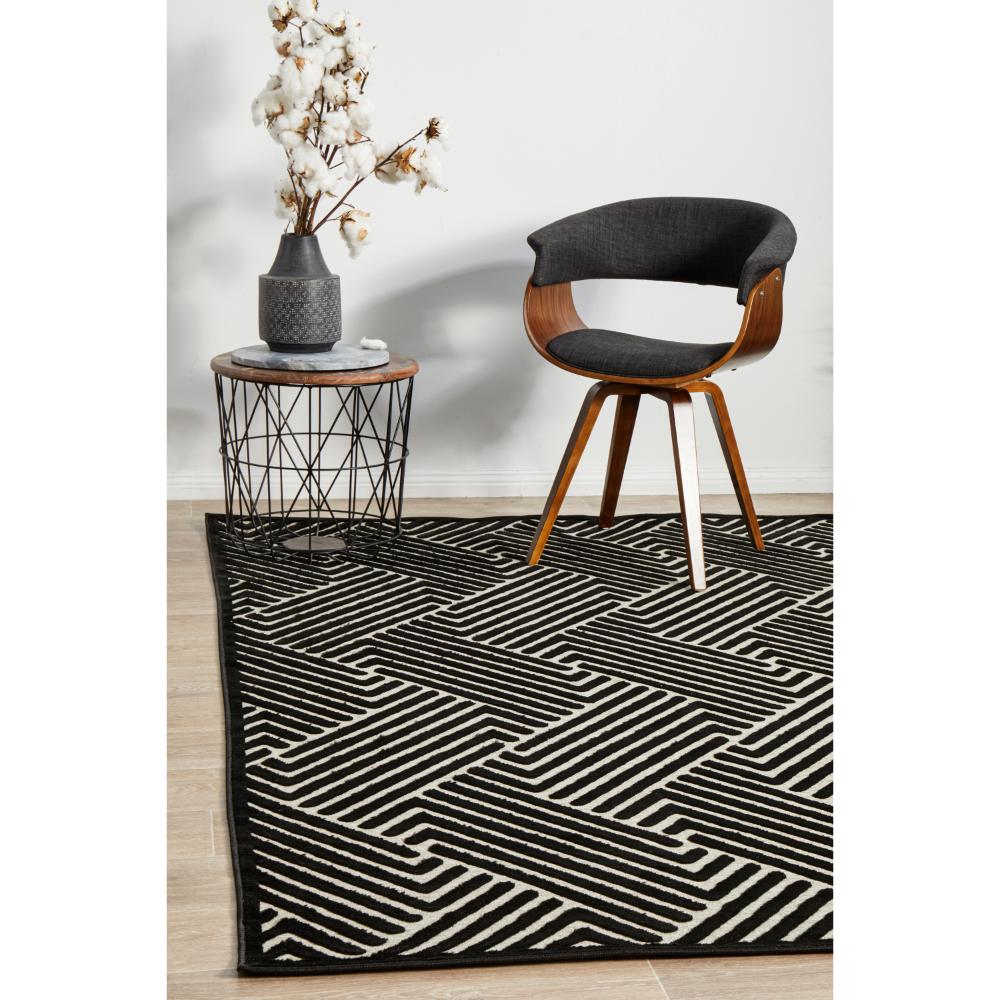 black and cream chevron rug with armchair and side table - MyHouse