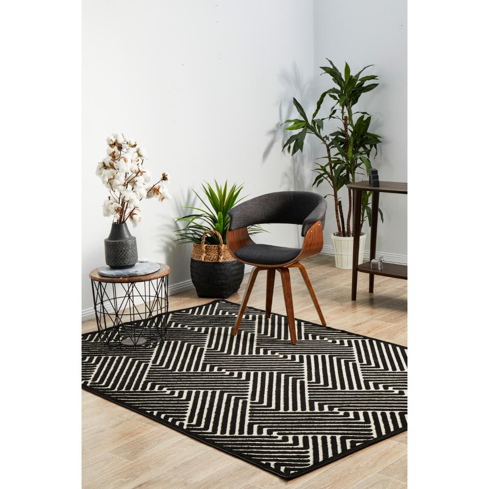 black and cream chevron rug with armchair and side table - MyHouse