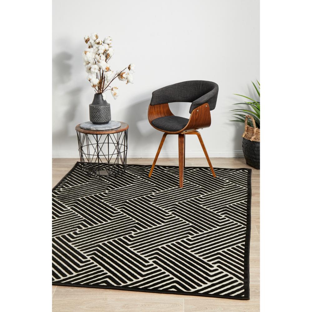 black and cream chevron rug with armchair and side table - MyHouse