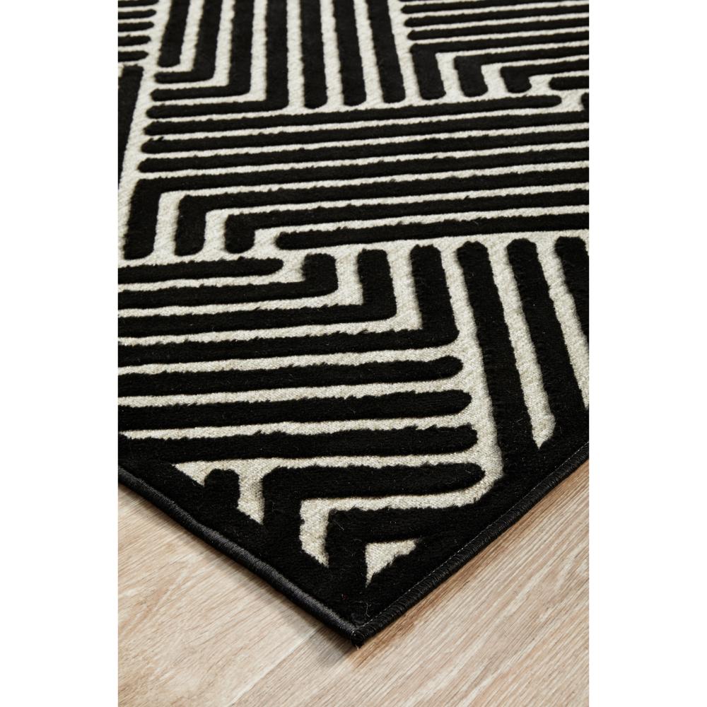 black and gold chevron patterned rug detail image - MyHouse