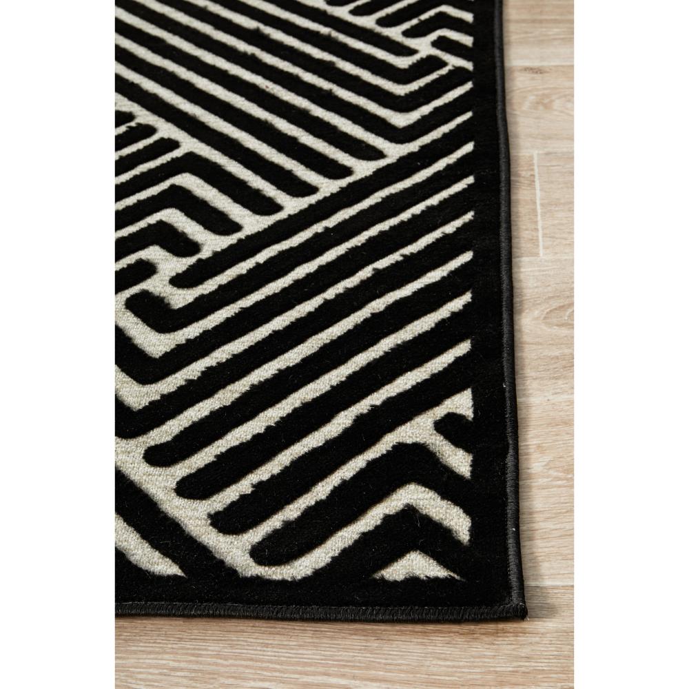 black and gold chevron patterned rug detail image - MyHouse