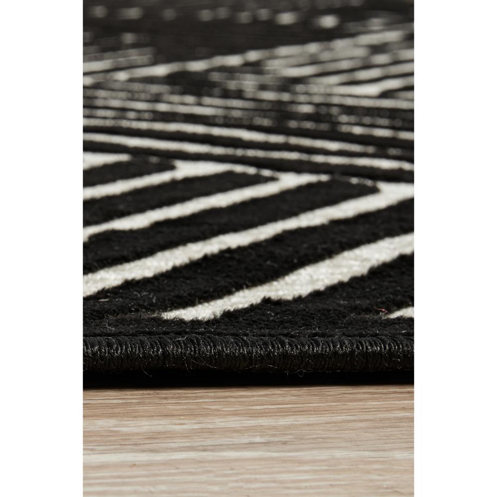 black and gold chevron patterned rug detail image - MyHouse