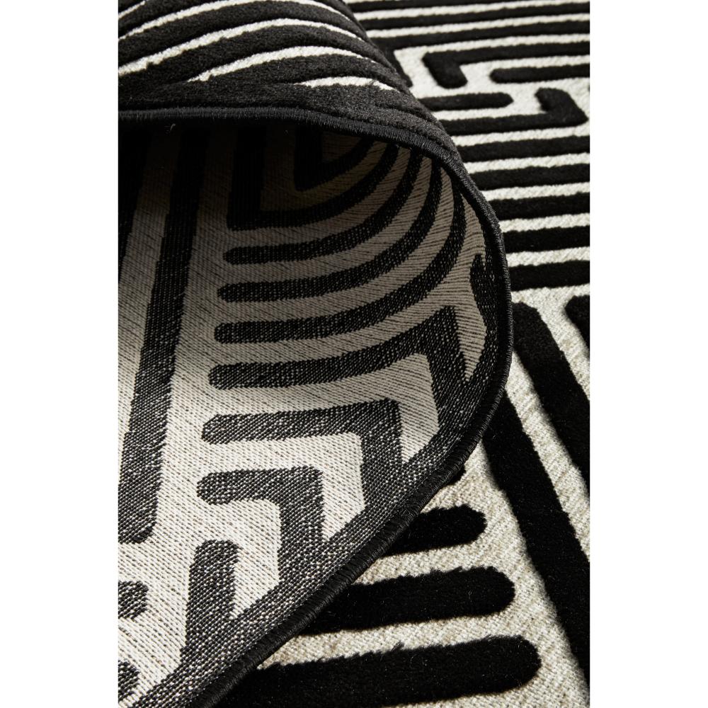 black and gold chevron patterned rug detail image - MyHouse