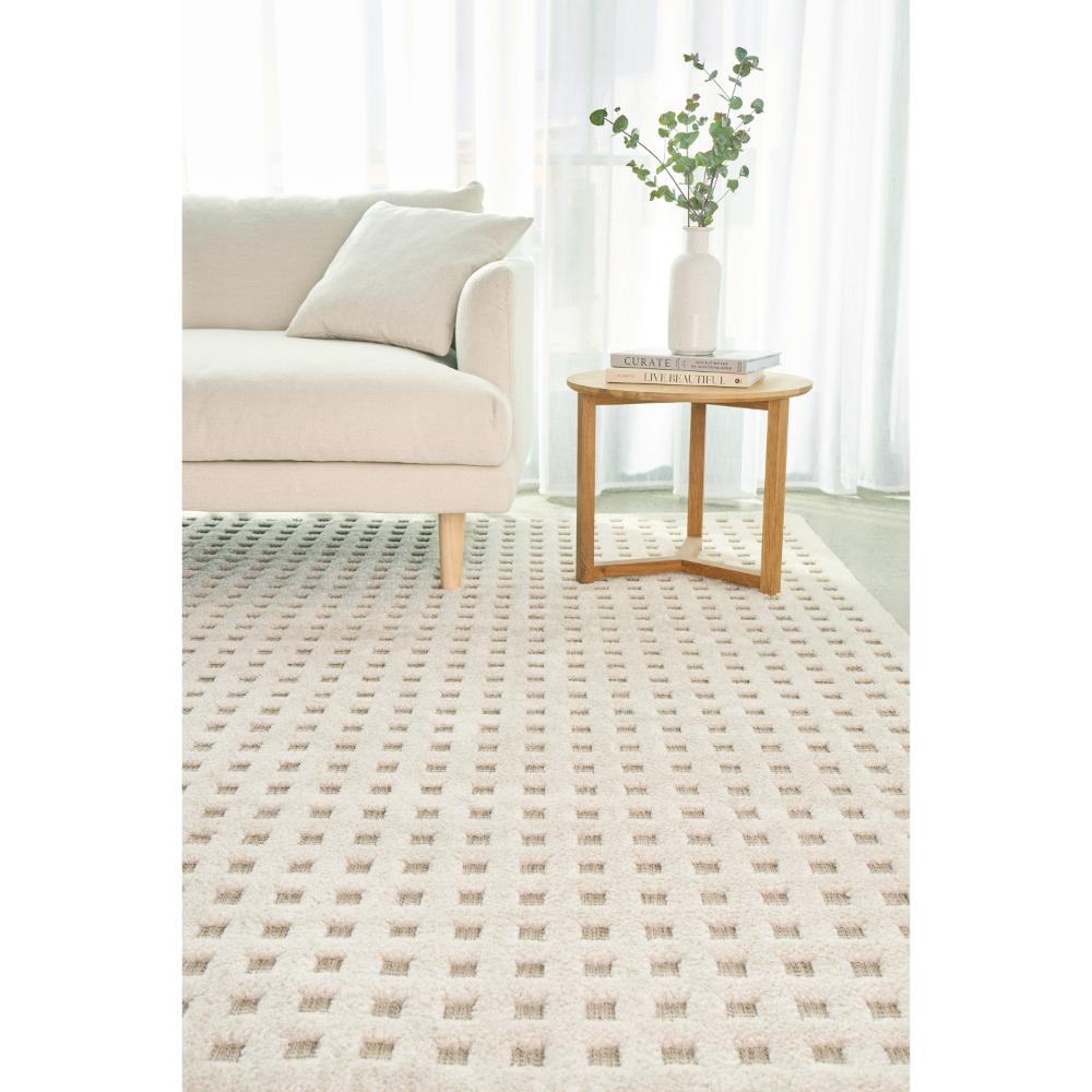 Natural beige small grid rug with lounge and table - MyHouse