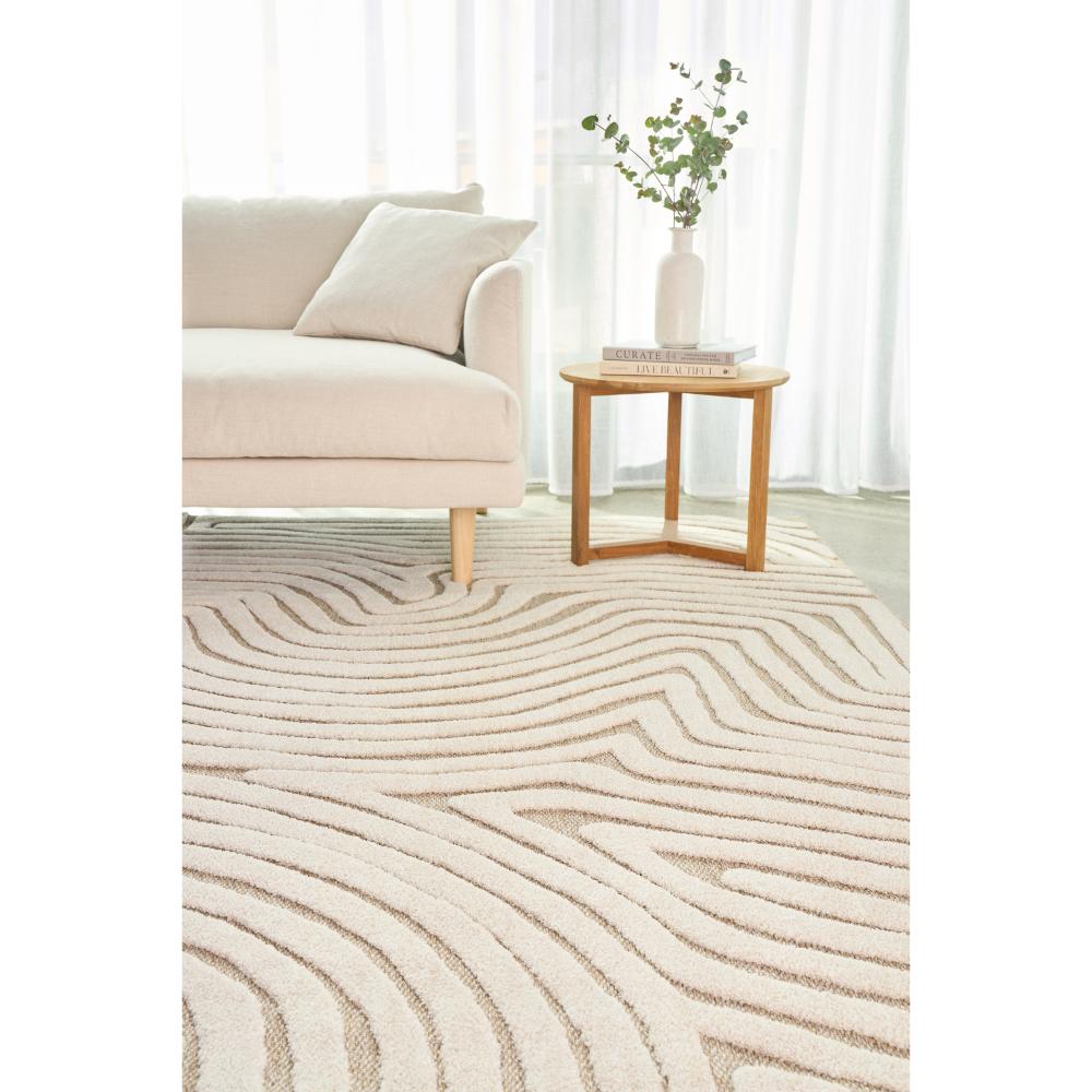 Natural beige swirl rug with lounge and side table - MyHouse