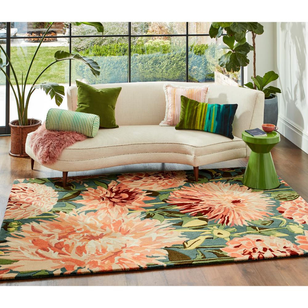 large orange dahlia flower wool rug in styled loungeroom - MyHouse