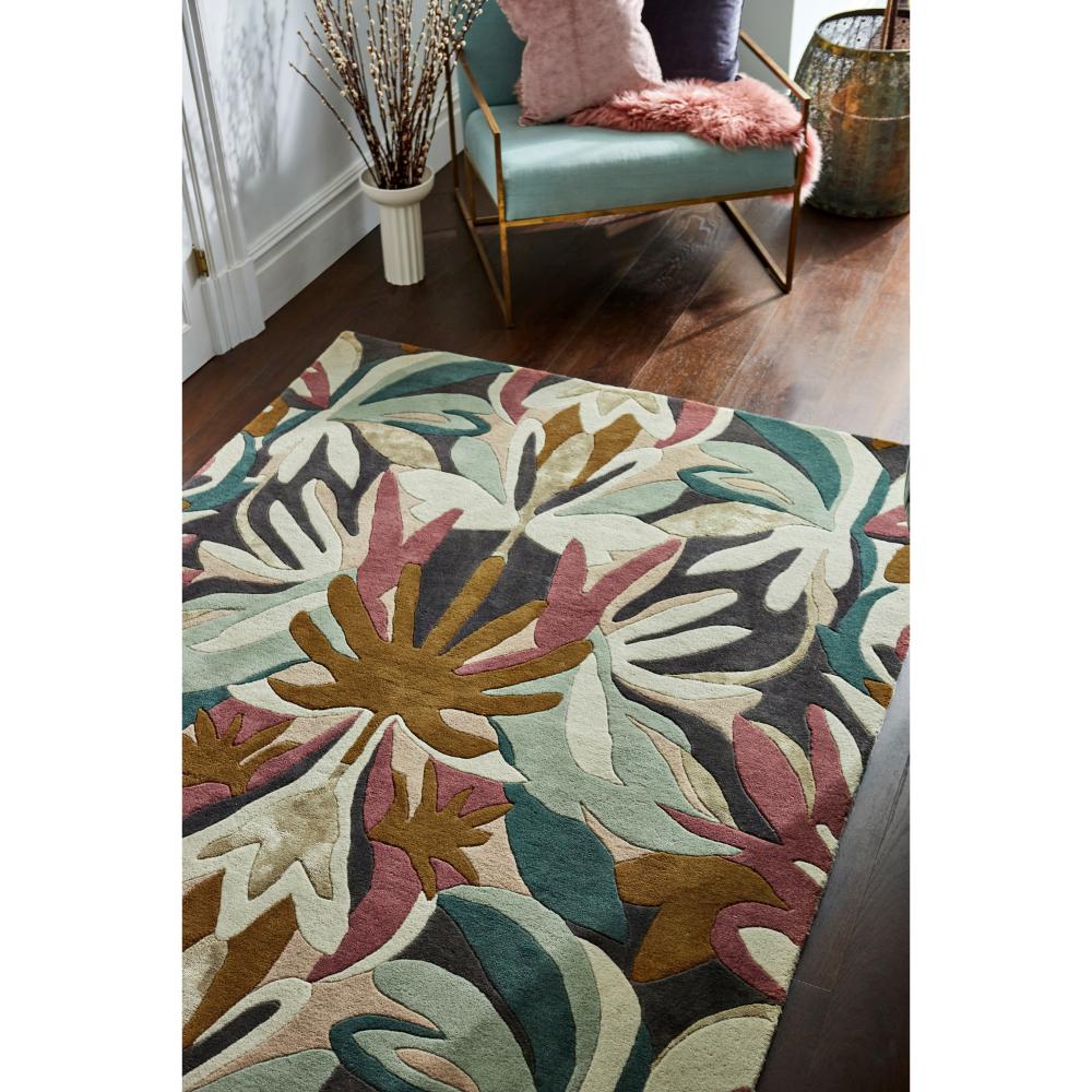 Green and burgundy Floral Wool Rug with green armchair - MyHouse