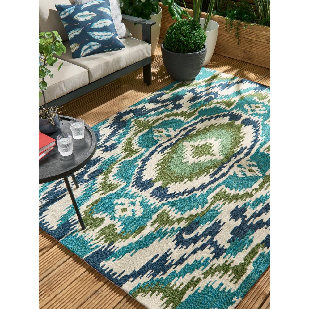 Blue, green aztec Indoor/Outdoor Rug in outdoor sitting area - MyHouse