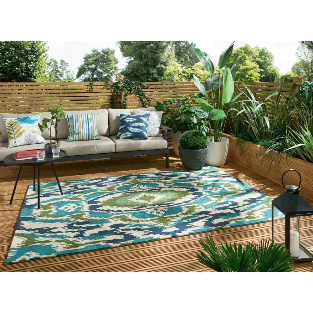 Blue, green aztec Indoor/Outdoor Rug in outdoor lounge area - MyHouse