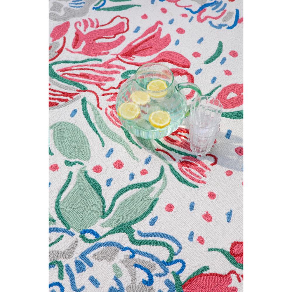 floral indoor/outdoor rug with a jug of water and lemon - MyHouse