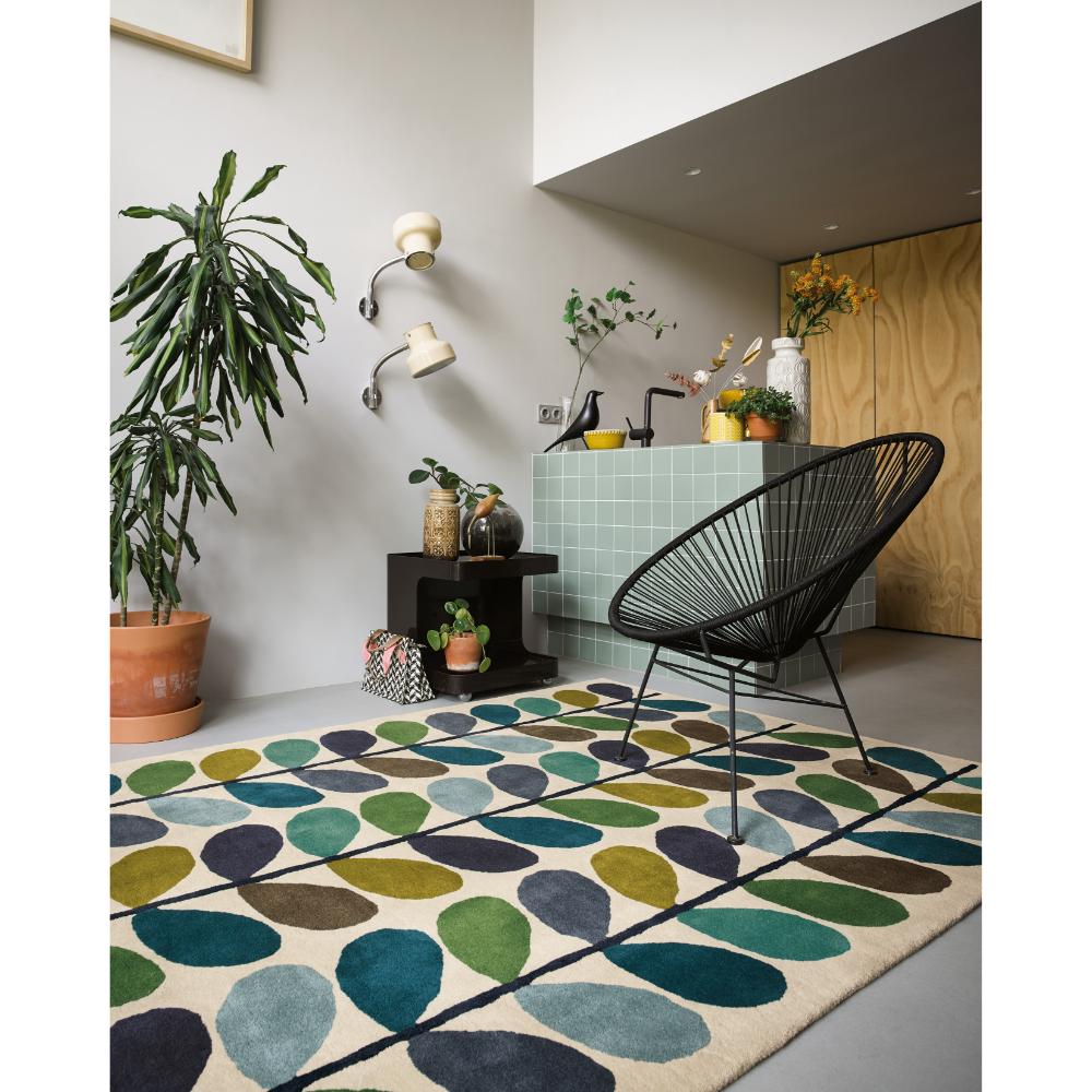 blue and green flower stem rug in living room - MyHouse