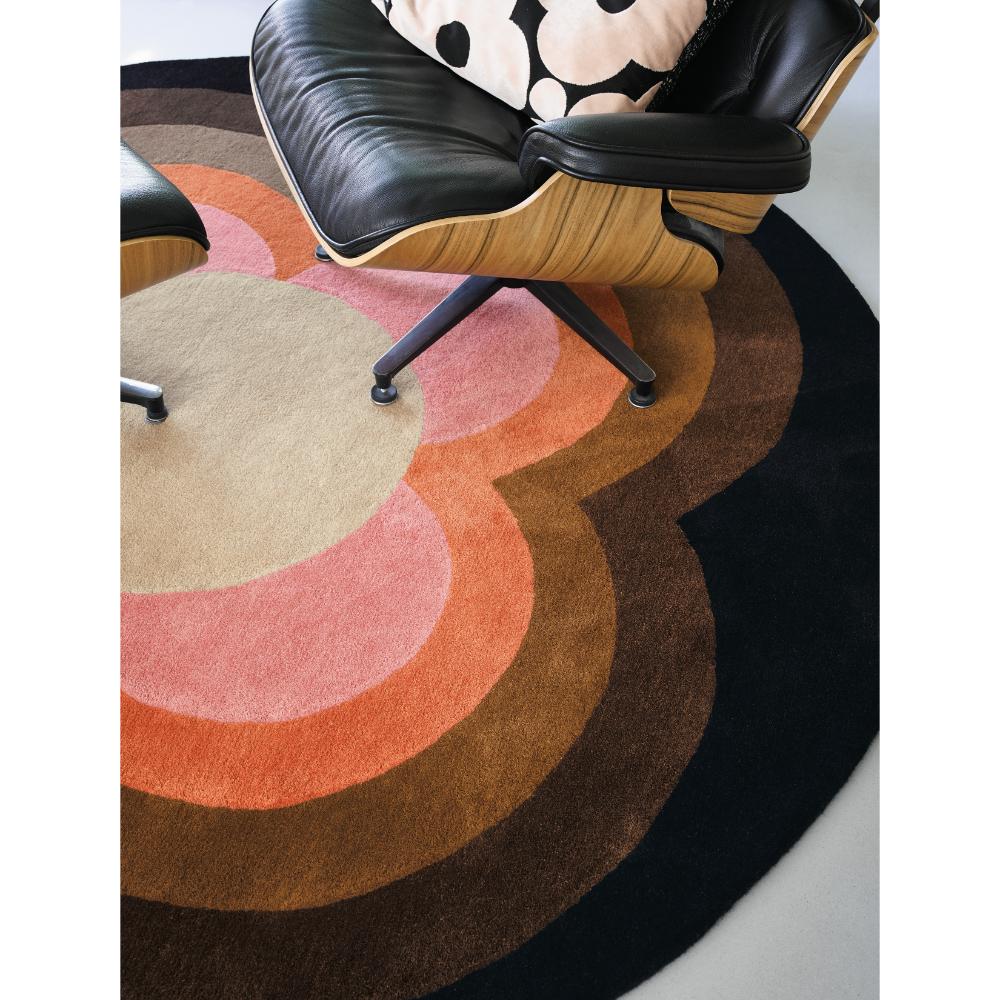 round pink and brown flower rug with black armchair - MyHouse