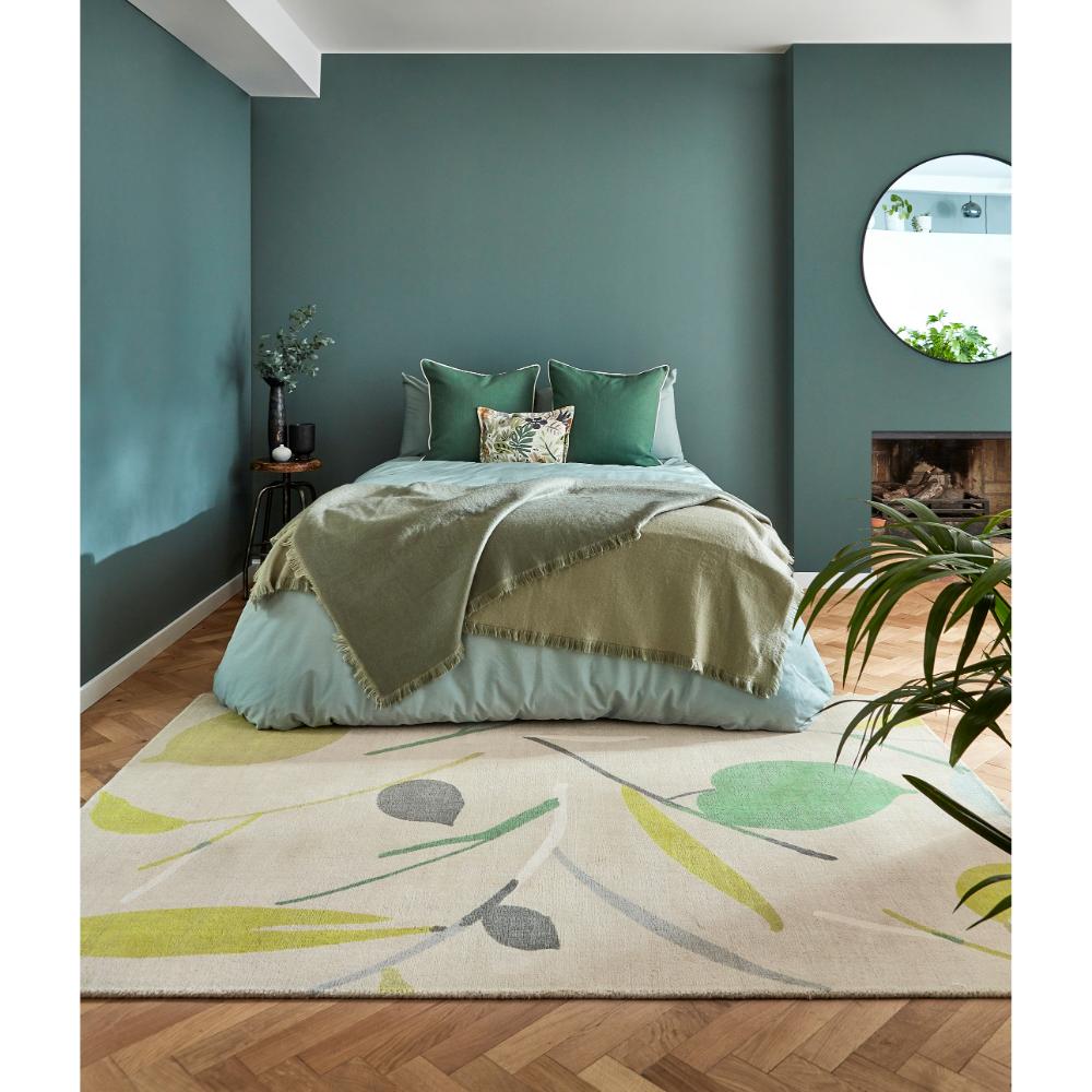 Green Leaf Print Wool Rug in bedroom with green walls - MyHouse