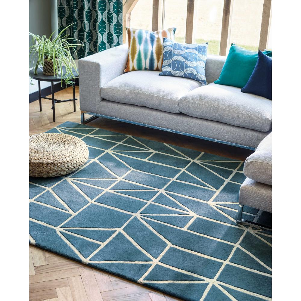 blue geometric wool rug with grey lounge - MyHouse