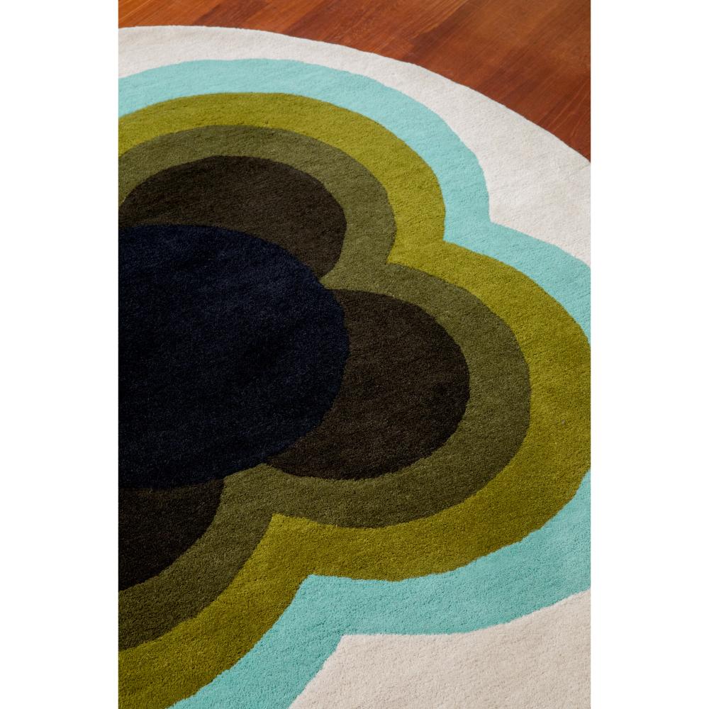 round green and blue flower rug on wooden floor - MyHouse