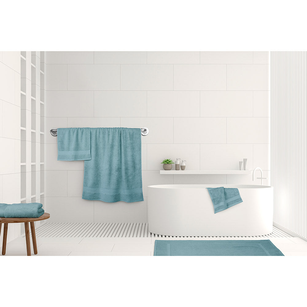 Algodon St Regis Bath Towels Mist blue at MyHouse. Bath towel, bath sheet, bath mat, hand towel and facewasher displayed in a bathroom