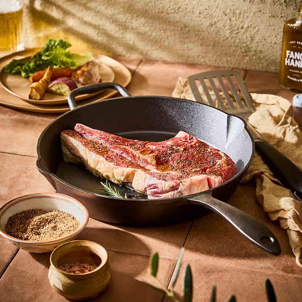steak in a cast iron frypan with helper handle - MyHouse
