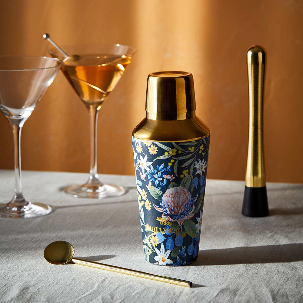 Alex Liddy Botanicah 3 Piece Cocktail Set. Floral and gold cocktail set on a table with 2 martini glasses