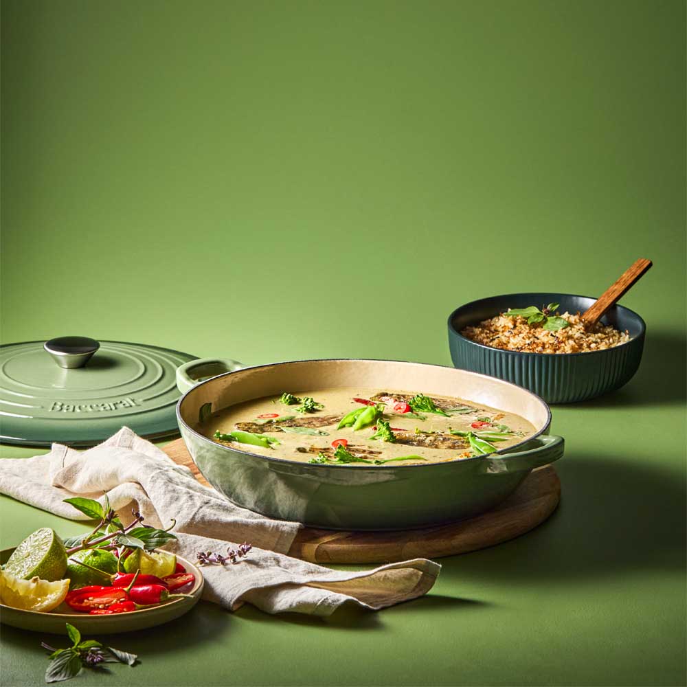 curry in green saute pan with a side of rice - MyHouse