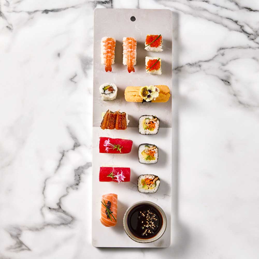 sushi platter on long marble serving board - MyHouse