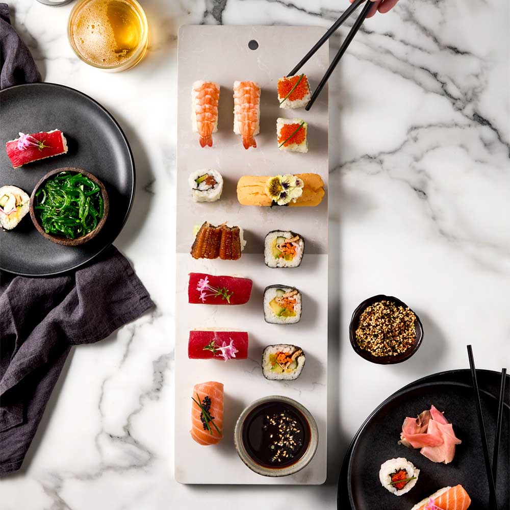sushi platter on long marble serving board - MyHouse