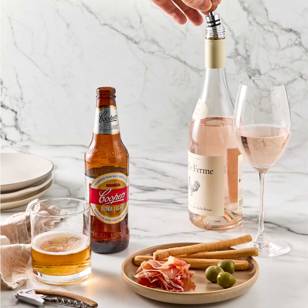 Wood Bottle Opener next to beer and Bottle Stopper  into wine bottle - MyHouse